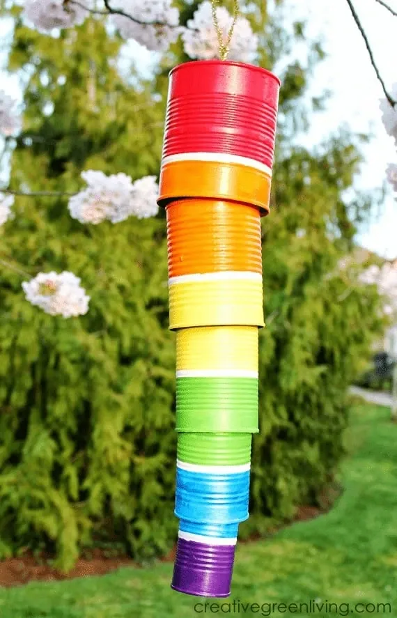 Easy rainbow pride craft - windchime yard art Rainbow wind chime made from tin cans hanging outside